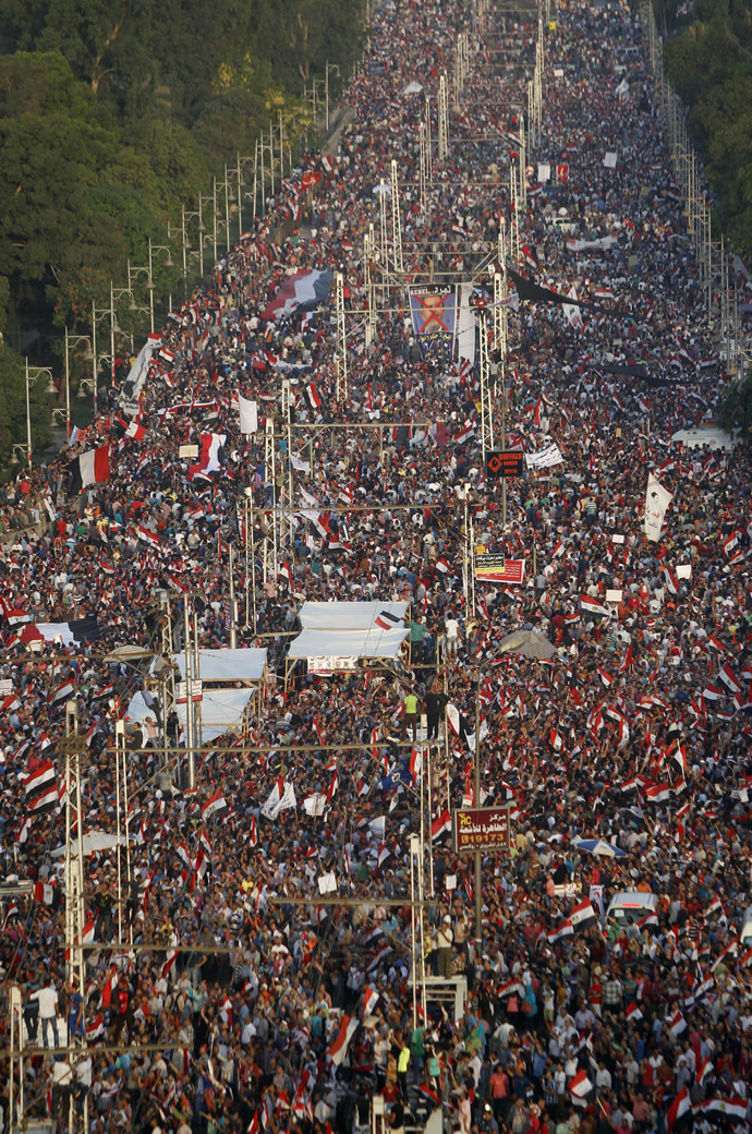 A
general view of protesters opposing Egyptian President Mohamed
Morsi waving Egyptian flags and shouting slogans against him and
members of the Muslim Brotherhood, during a protest in front of
El-Thadiya presidential palace in Cairo June 30, 2013. (Reuters)