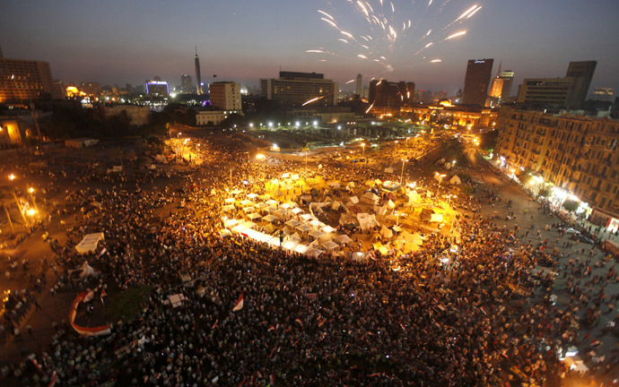 Protesters opposing
Egyptian President Mohamed Morsi shout slogans and set off
fireworks during a protest in Tahrir square in Cairo June 29,
2013. (Reuters)
